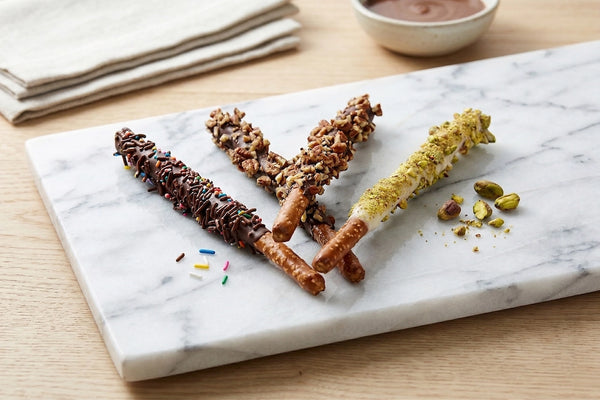 Sunflour Baking Company's Dipped Pretzels - 4pk blends sweet and salty flavors with sprinkles, nuts, and pistachios.