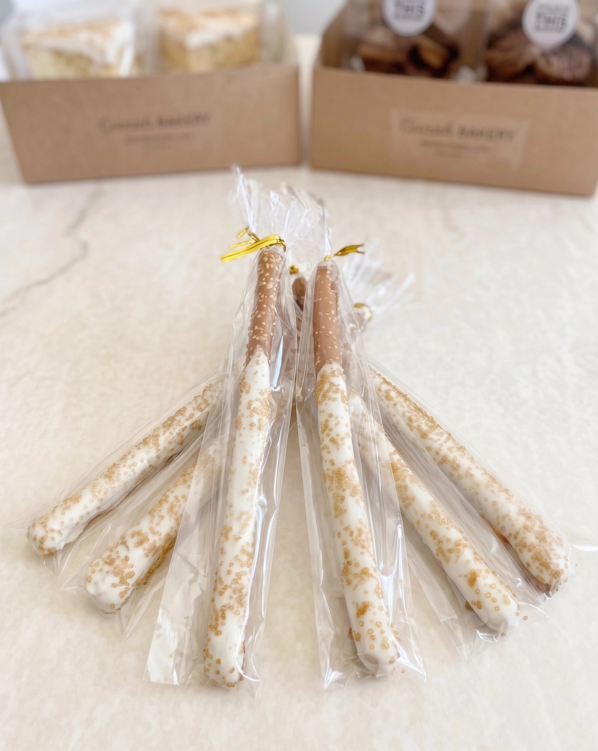 Six chocolate-dipped pretzel rods from Sunflour Baking Company are a perfect addition to the Cookie Gift Basket.