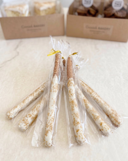 Six chocolate-dipped pretzel rods from Sunflour Baking Company are a perfect addition to the Cookie Gift Basket.